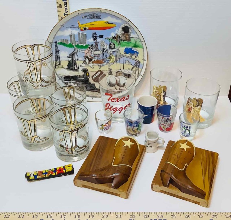 lot 198 image: Texas Cocktail Glasses, Midland Collector Plate, Shot Glasses, Boot Bookends (LR)