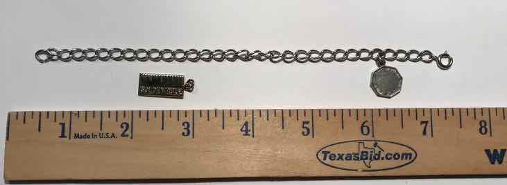 lot 922 image: Jewelry  Bracelet, Charm, Wells Sterling Golden Rule - Do Unto Others Charm