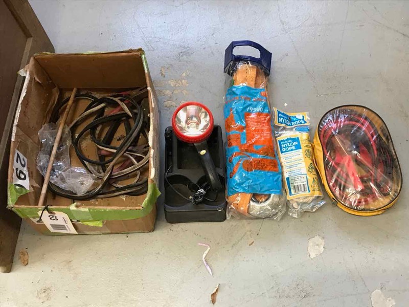lot 63 image: Car Care Lot Tow Strap, Jumper Cables, Tire Gauge, Etc.