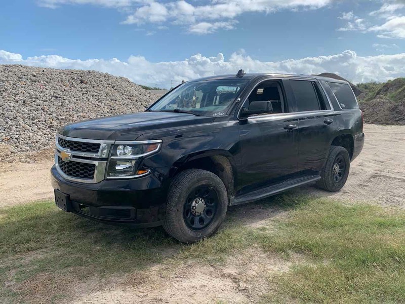 lot 406 image: 2016 Chevrolet Tahoe Police Vehicle, black, started, see video, broken windows odo 20,318,  (VIN  1GNLCDECXGR148393)