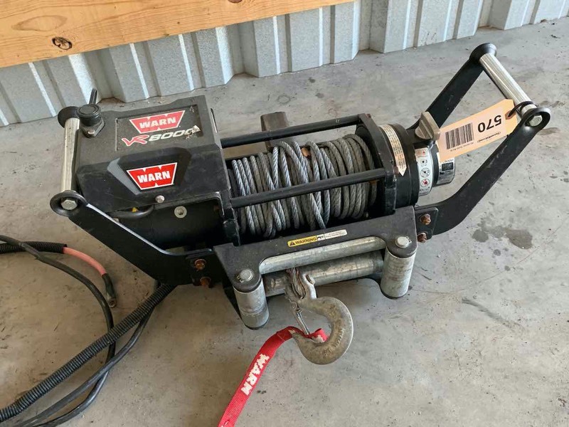 lot 570 image: Asset Forfeiture  Warn VR8000, 12V Winch with Receiver Hitch Cradle