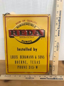 lot 515 image: Antique Small Tin Sign Submergible Reda Pumps, Installed by Louis Bergmann & Sons Boerne, Texas Phone 315-W