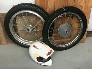 lot 518 image: (2) Motorcycle Tires and a Snell Helmet