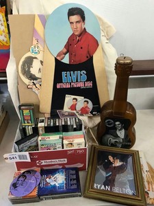 lot 541 image: Elvis Presley Cardboard Marketing Displays, Old Calenders, Cassettes, Movies, VCR Tapes, Etc.