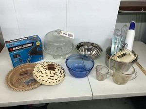 lot 565 image: CakesPies Mixing Bowls, Measuring Cups, Whisks, Covered Cake Stand, Covered Chocolate Pie Carrier with Recipe, Hand Mixer