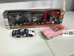 lot 583 image: PInk Cadillac Friction Toy, Elvis Presley Car Hauler Set and a Die Cast Bank with Key