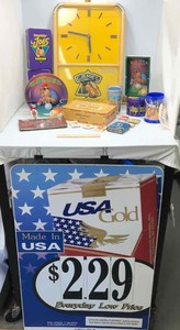 lot 619 image: Camel Cigarette Tobacco Items Lighters, Clock, Cups, Tins and US Gold Sign