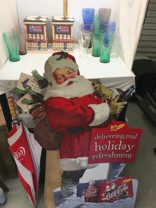 lot 650 image: Coca-Cola Glass Drinking Glasses, (2) lighted buildings, Cardboard Stand-Up Santa, Umbrella