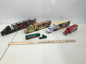 lot 691 image: (5) Car Carriers Yellow, Ford Motorcraft, Remington, Western Auto, UAW Delphi