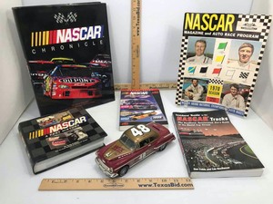lot 745 image: (5) NASCAR BooksProgram, (1) Die Cast Coin Bank 48 Bill France