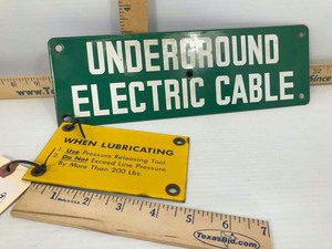 lot 834 image: (2) Small Porcelain Enamel Signs Underground Electric Cable (green), When Lubricating (yellow)