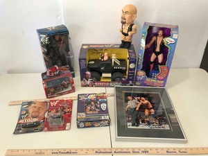 lot 872 image: Stone Cold Steve Austin Assortment Action Figures, Cars, Bobble Head, Etc.