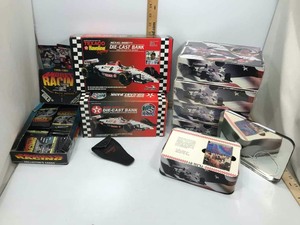 lot 931 image: Mario AndrettiAndretti Racing (5) Tins wCards, Collector Cards, (2) Coin Banks