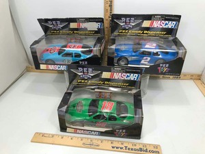 lot 942 image: (3) Candy Pez Dispensers (racing cars)
