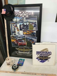 lot 951 image: Indianapolis Motor Speedway Brickyard 400 Framed Poster, Seat Cushions, Mug, tin, Toy Car
