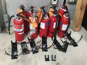 lot 5 image: Ten fire extinguishers and nine brackets.  Type ABC Dry Chemical