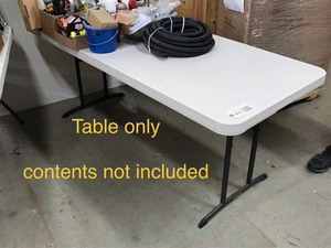 lot 473 image: Folding Table, 6 ft (folds in half) (contents not included)