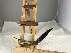 lot 767 image: (3) Folding Knives Stainless Steel Japan (eagle), Multi-Tool (wood), pocket (wood)