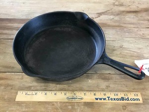 lot 22 image: Cast Iron Skillet Griswold Erie PA 704J
