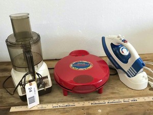 lot 24 image: (3) Small Appliances Oreck Iron, Sunbeam Le Chef, Santa Fee Quesadilla Maker