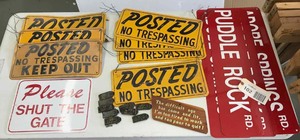 lot 102 image: Posted no trespassing signs and other assorted signs