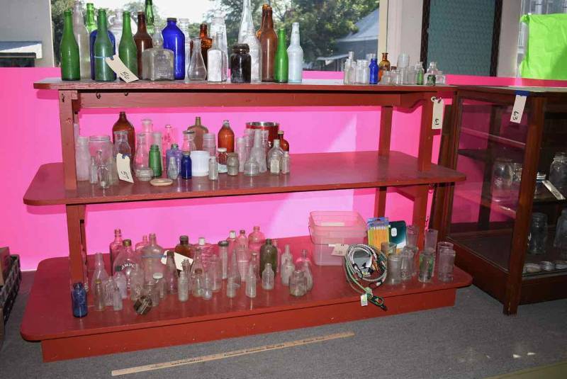 lot 61 image: Vintage Red Hardware Store Cabinet