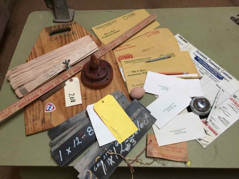 lot 208 image: Bergmann Lumber Yard Stick, Paint Stirs, Ringy-Dingy Counter Bell, Envelopes, Blade Holder, Pencil Cup, Etc.