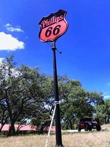 lot 232 image: Antique Phillips 66 Shield-Shaped Sign & Post