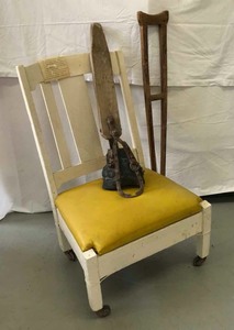 lot 54 image: Historic Boerne  Lex Sanitorium, Handcrafted Wood Leg, Chair and Crutch by Mr. August Wilheim Willie Scharf