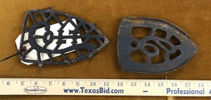 lot 107 image: (2) Antique Cast Iron Trivets  Colt & C