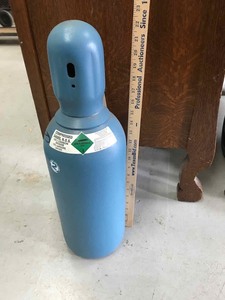lot 74 image: Small Compressed Gas Bottle 75%25% (unknown how full)