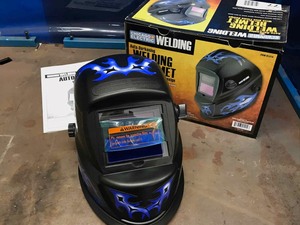 lot 77 image: New in Box Chicago Industries Auto Darkening Welding Helmet.