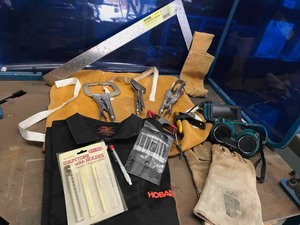lot 83 image: Asst. Welding Accessories Leather Apron, Shirt, Gloves, Goggles, Square, Spring Clamps, Welding Vise Type Clamps, Etc.