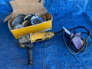 lot 82 image: Dewalt 4-12 Inch Angle Grinder