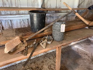 lot 127 image: Fencing Items post hole digger, barbed wire, come-along, staples, etc.
