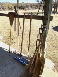 lot 112 image: Scoops, spreaders, rock rake, broom, rebar dinnerbell, clipper